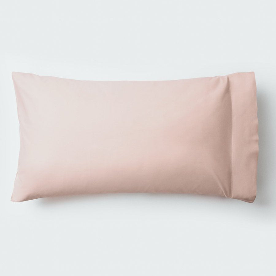 A pillow with an elegant Kyoto Blush color pillowcase. - {{Kyoto Blush}}