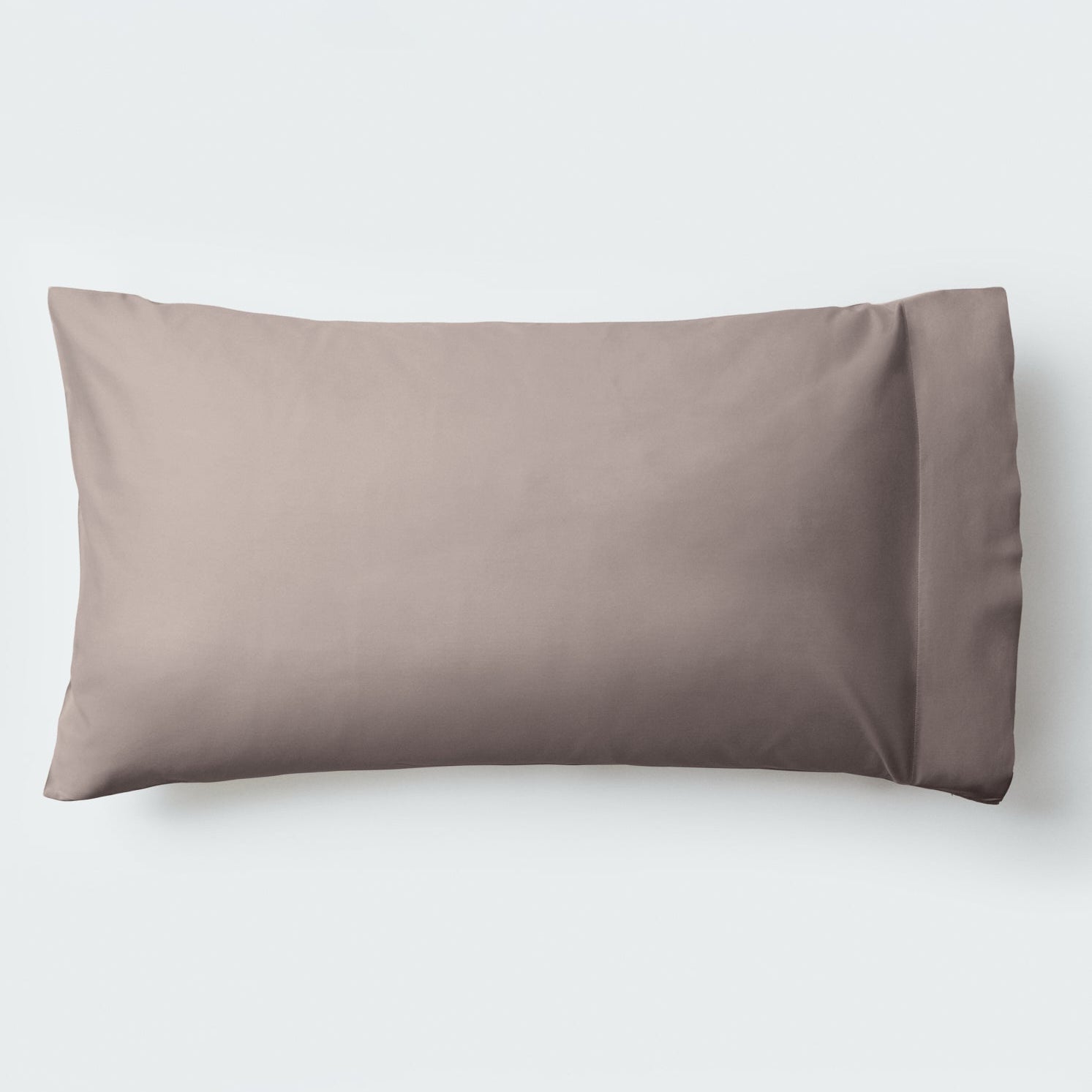 A pillow with an elegant Moroccan Sand color pillowcase. - {{Moroccan Sand}}