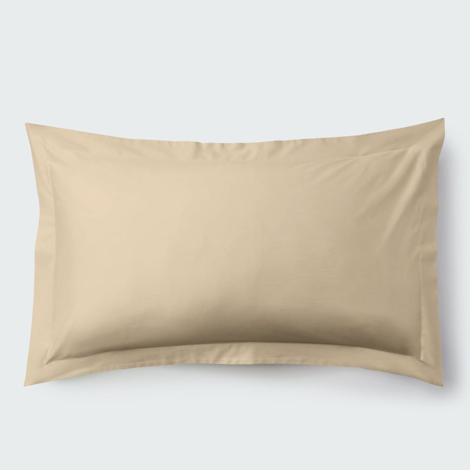 A rectangular pillow with an Egyptian Camel color pillowcase, featuring a delicate embroidery that runs along the entire edge. - {{Egyptian Camel}}