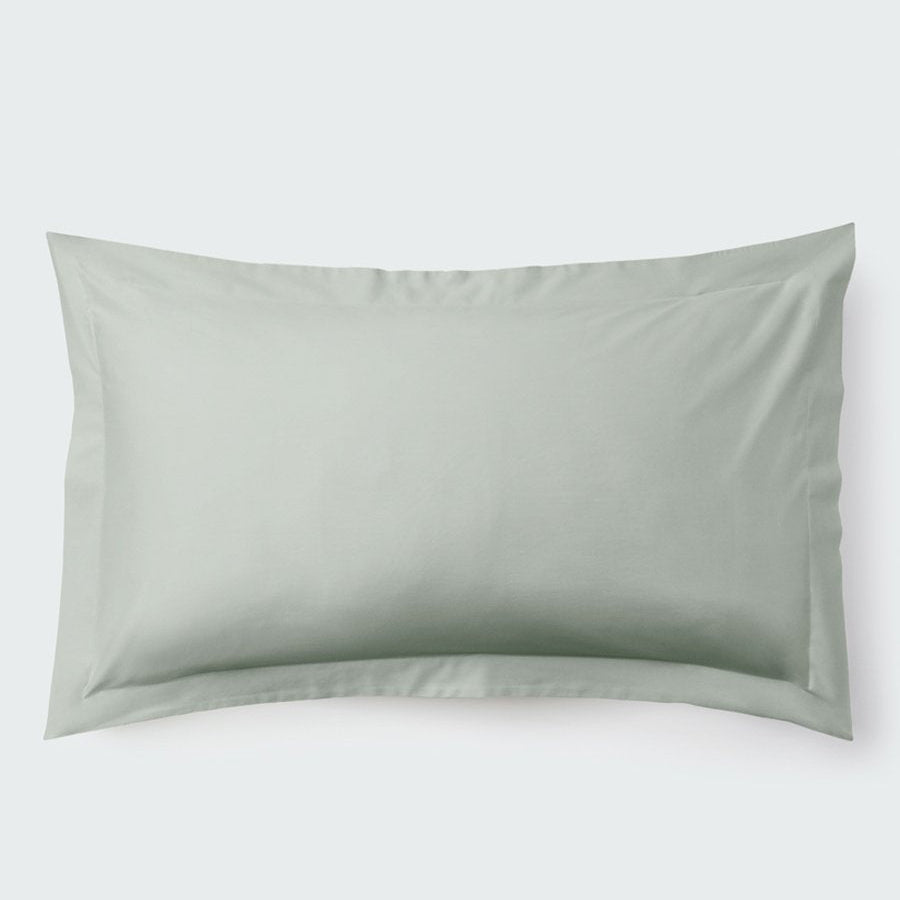 A rectangular pillow with a Florentine Sage color pillowcase, featuring a delicate embroidery that runs along the entire edge. - {{Florentine Sage}}