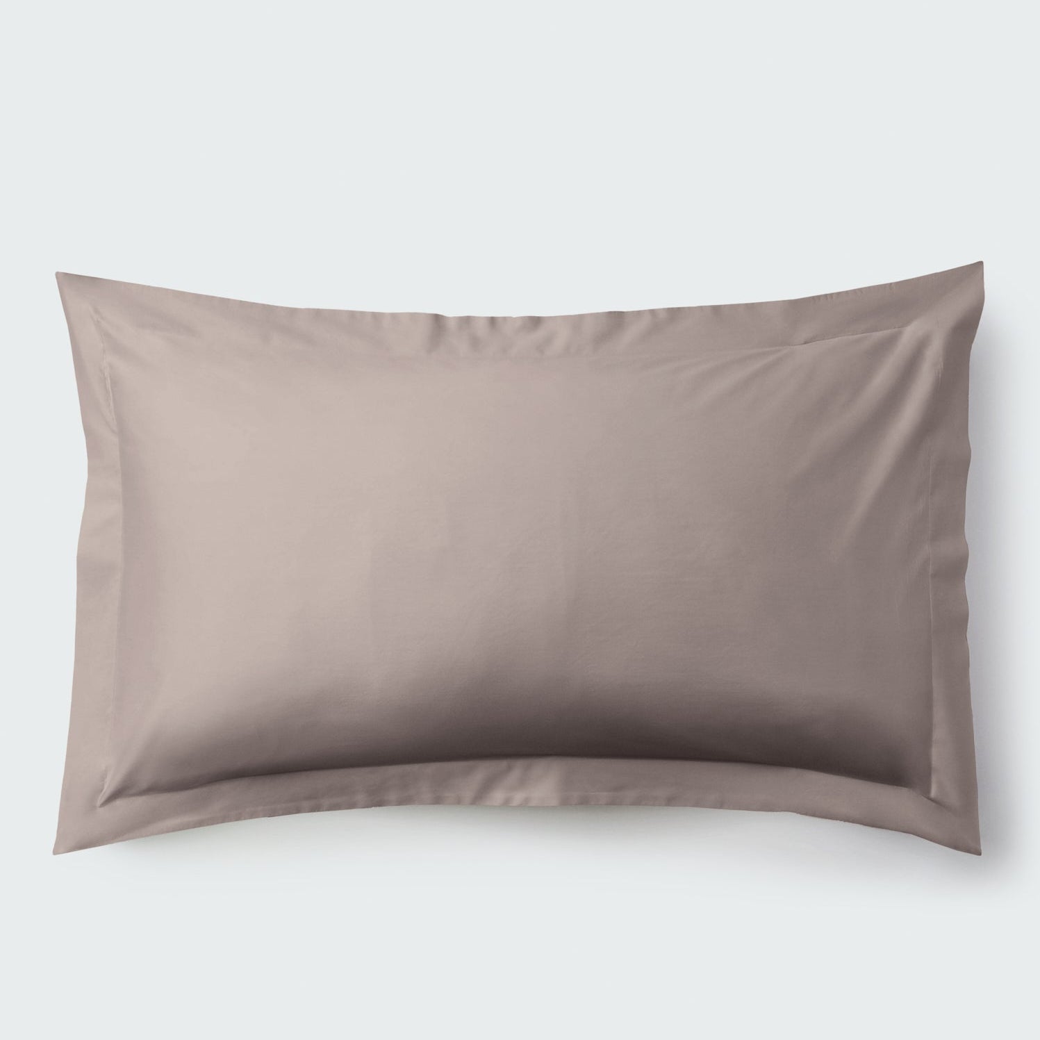 A rectangular pillow with a Moroccan Sand color pillowcase, featuring a delicate embroidery that runs along the entire edge. - {{Moroccan Sand}}