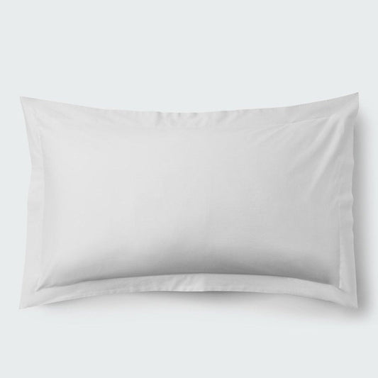 A rectangular pillow with a Signature White color pillowcase, featuring a delicate embroidery that runs along the entire edge. - {{Signature White}}