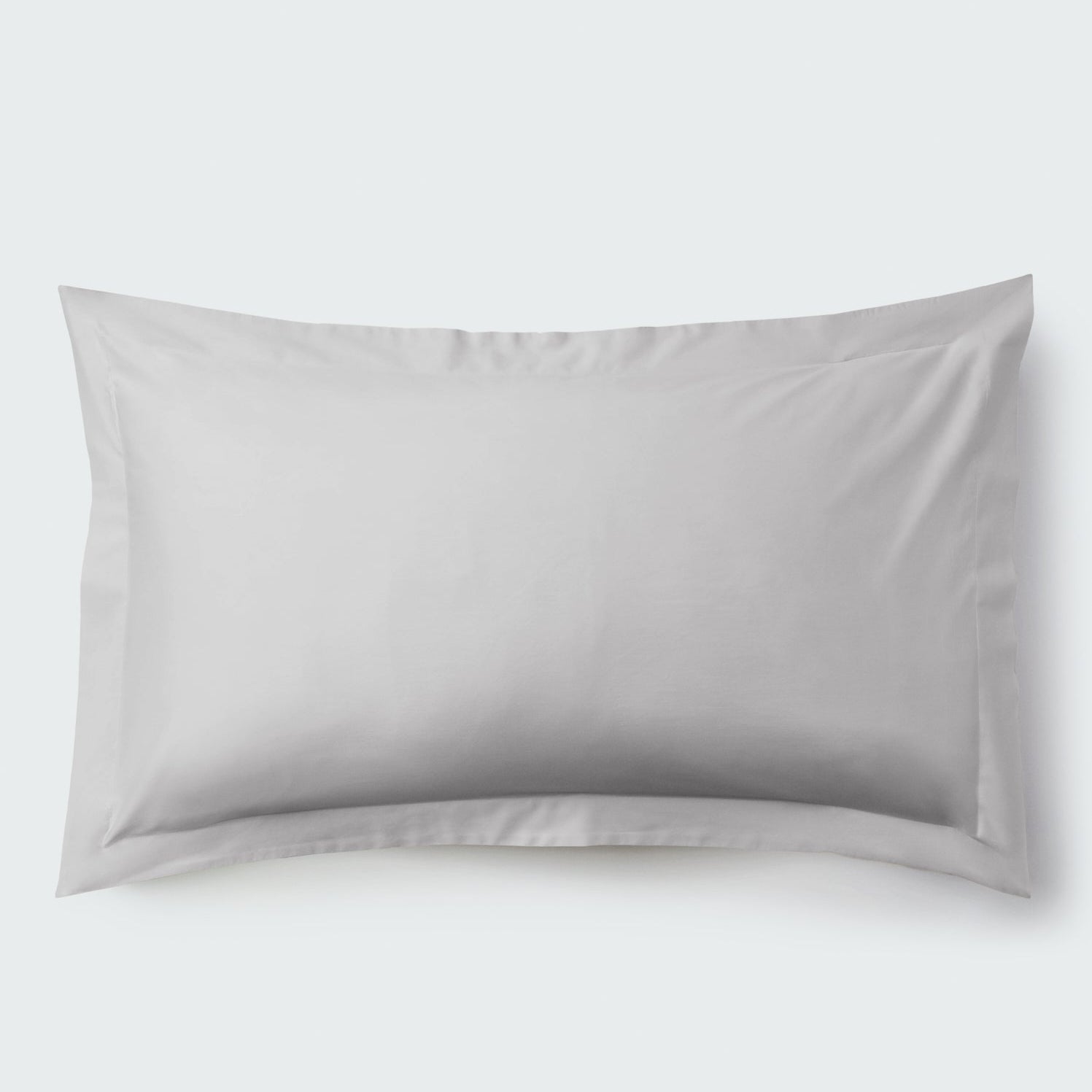 A rectangular pillow with a Turkish Silver color pillowcase, featuring a delicate embroidery that runs along the entire edge. - {{Turkish Silver}}