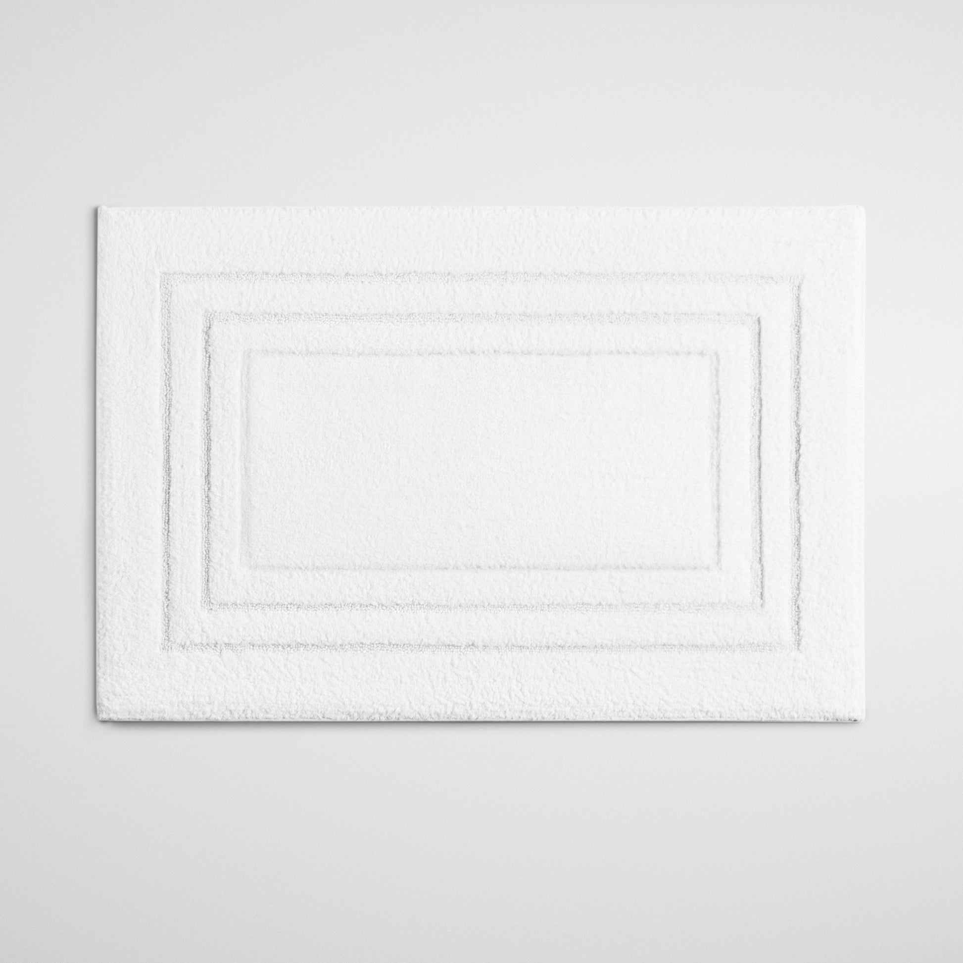 Four Seasons Plush Bath Mat, soft white mat with triple frame design, cozy and luxurious bathroom addition