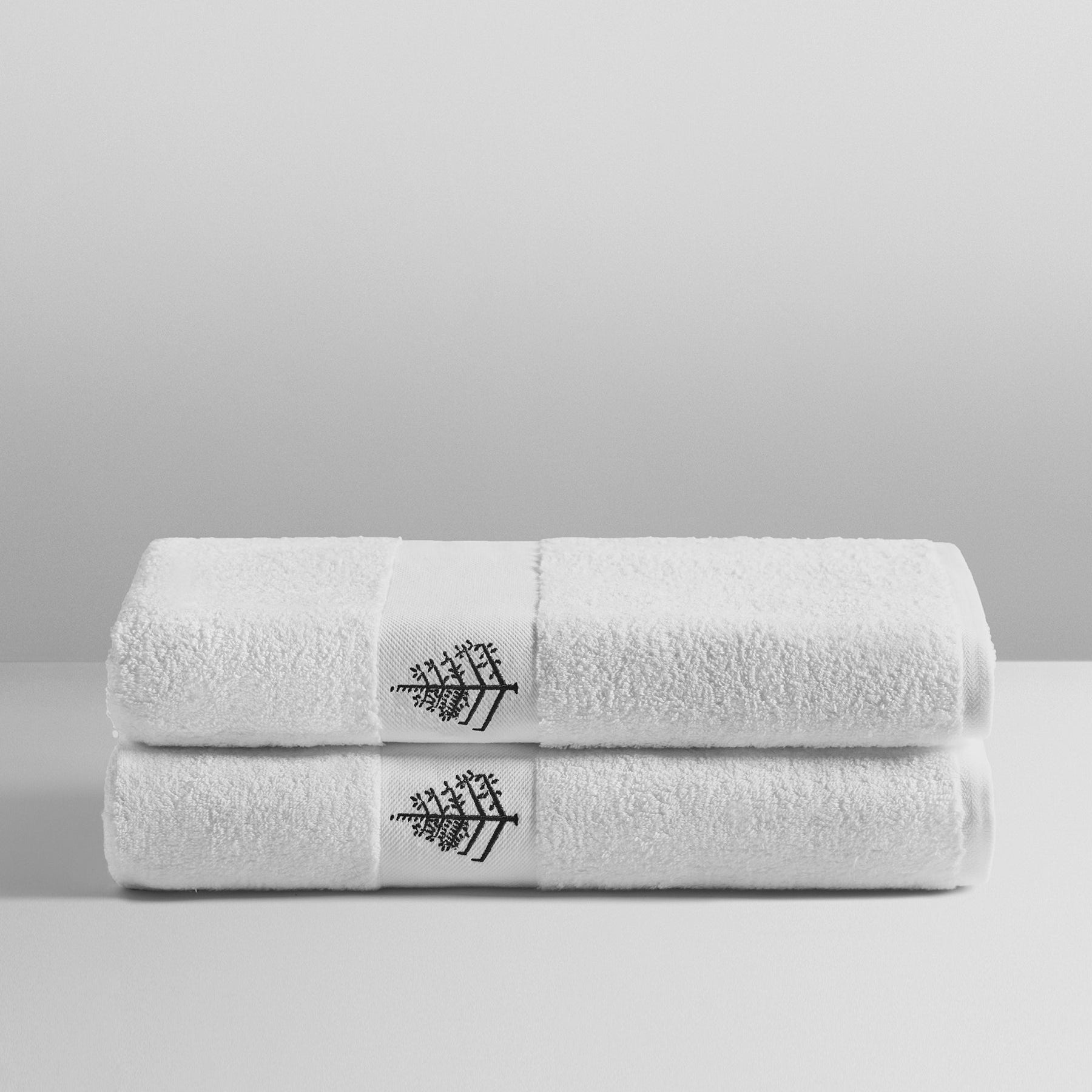 Four Seasons Pool Towel Set, lush white towels with black embroidered logo, made from super combed cotton