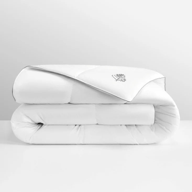 White pure down duvet folded with a Four Seasons logo on a light gray background.