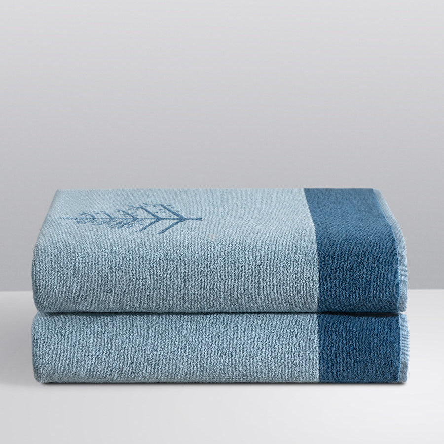 A "Polynesian Lagoon" Resort Towel with a subtle embroidered Four Seasons logo. The towel feature a darker "Polynesian Lagoon" border. - {{Polynesian Lagoon}}