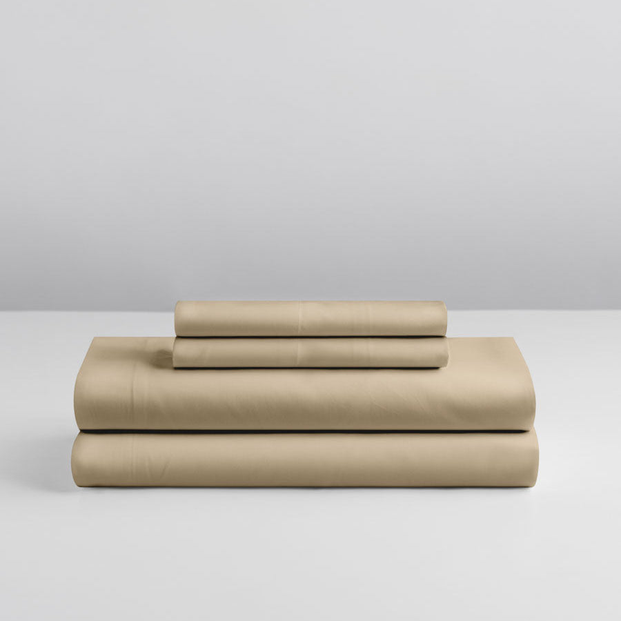 Stacked Egyptian Camel sheet set folded neatly on a white surface. {{Egyptian Camel}}
