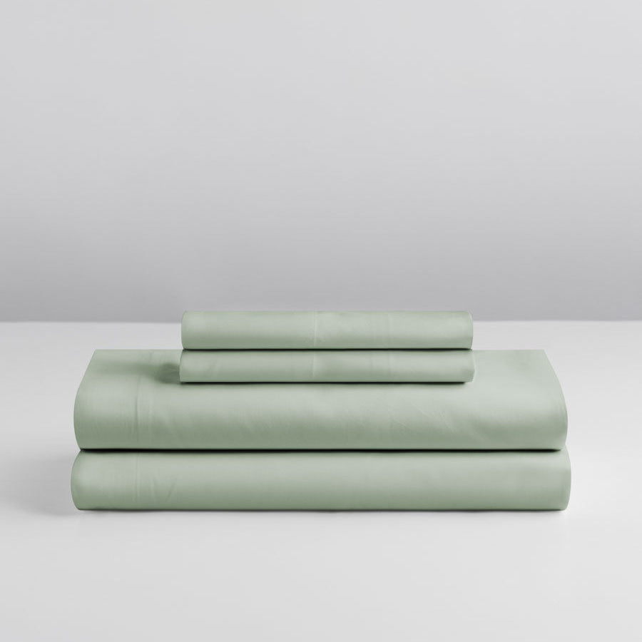 Stacked sheet set in Florentine Sage showing folded fitted and flat sheets. {{Florentine Sage}}
