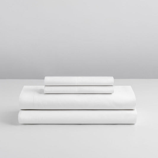 Signature White sheet set neatly stacked—deep pocket fitted sheet, flat sheet, and two pillowcases. {{Signature White}}