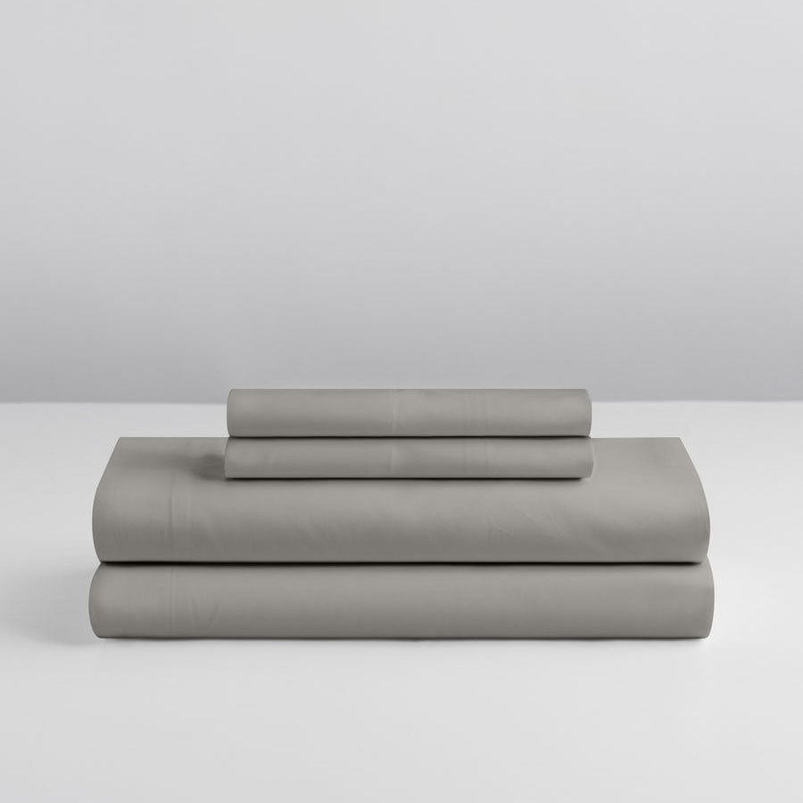 Four Seasons Signature Sheet set folded in Spanish Slate on a grey background. {{Spanish Slate}}
