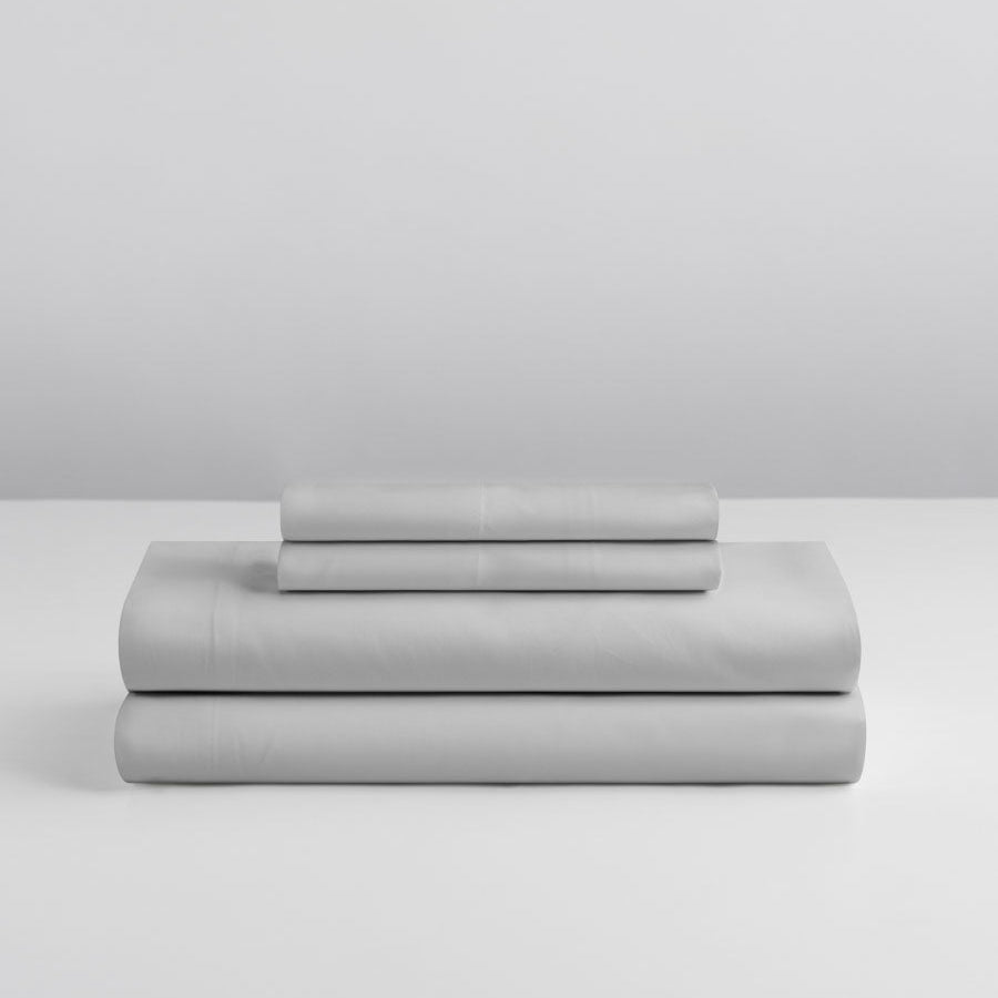 Four Seasons Signature Sheet set folded in Turkish Silver on a grey background. {{Turkish Silver}}