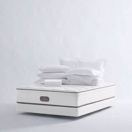 Four Seasons Bedding Set. The set includes a white mattress, a white comforter, and several white pillows, all neatly arranged on a white background.