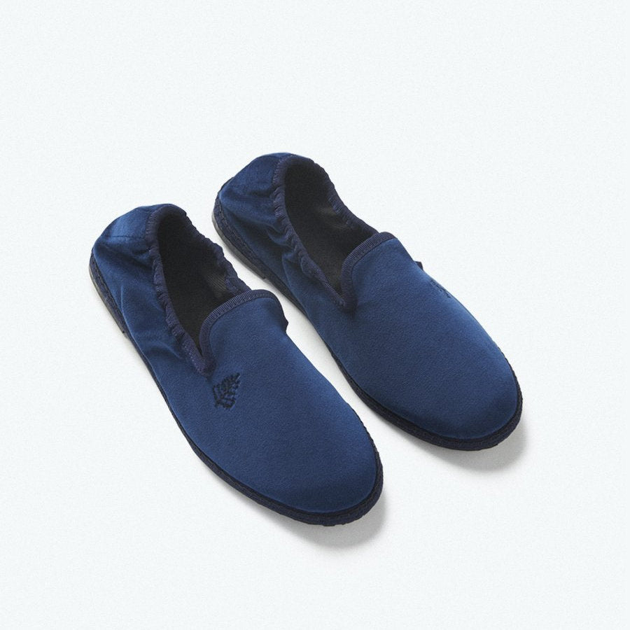 Close-up of the Four Seasons Velvet Slippers in Riviera Navy, showcasing the luxurious velvet fabric and artisanal hand-stitching. - {{Riviera Navy}}