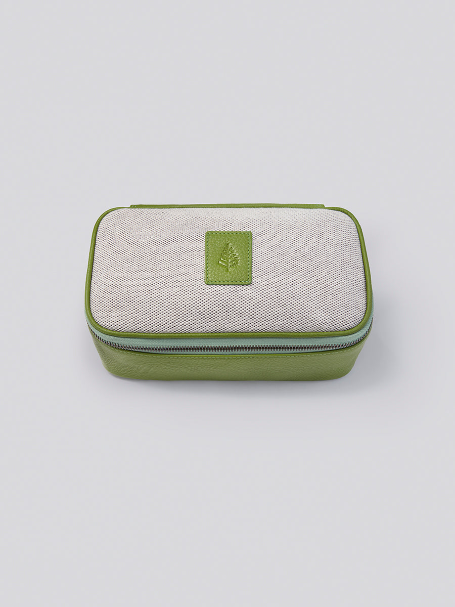 The Tech Case, a compact and stylish organizer for your tech accessories, crafted from Italian Pebble Grain Leather and Organic Cotton Toile in a vibrant Kyoto Matcha green.