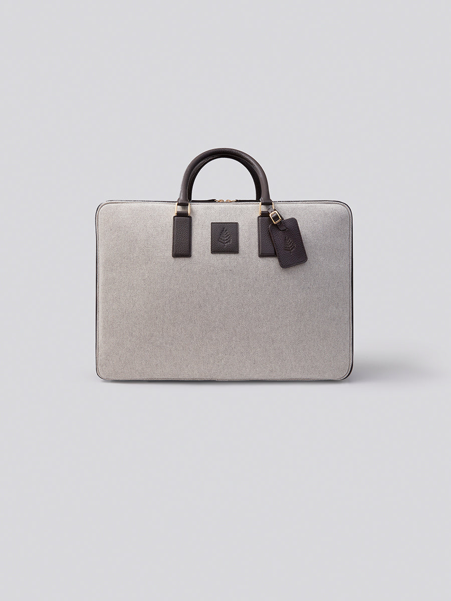 Close-up of The Valisette travel bag, showcasing its luxurious materials and elegant design with contrasting textures.