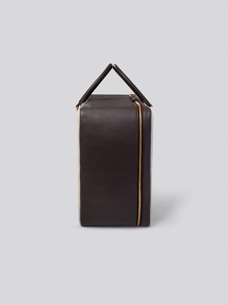 Side view of The Valisette travel bag in Malaysian Cocoa from the Four Seasons Travel Collection.