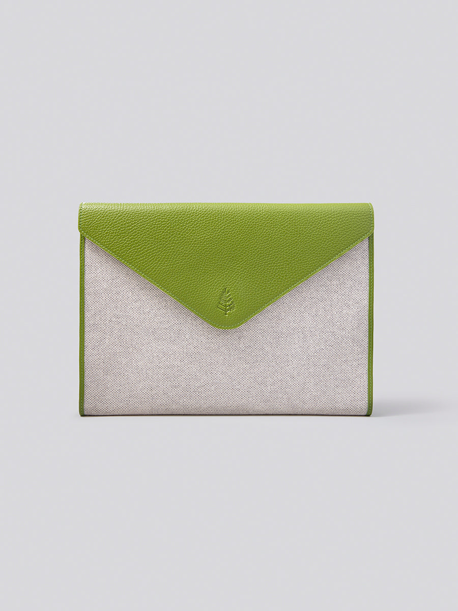 The Laptop Sleeve, a protective and stylish case for your laptop or tablet, crafted from Italian Pebble Grain Leather and Organic Cotton Toile in a vibrant Kyoto Matcha.