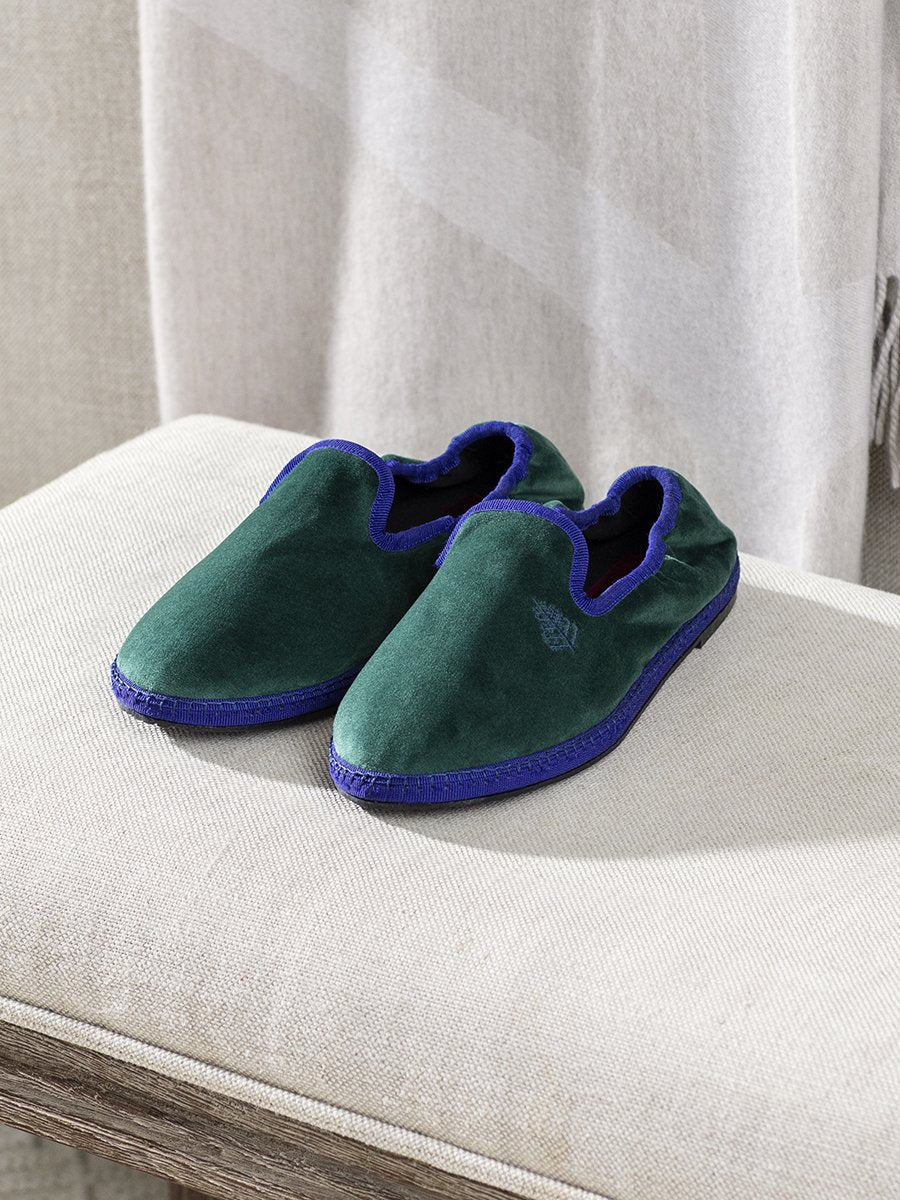 Hand-stitched Velvet Slippers in Anguilla Green with a sustainable rubber sole, offering a combination of style and comfort.